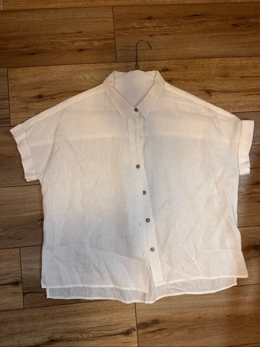 Woman’s White Short-Sleeve Button-Up Shirt